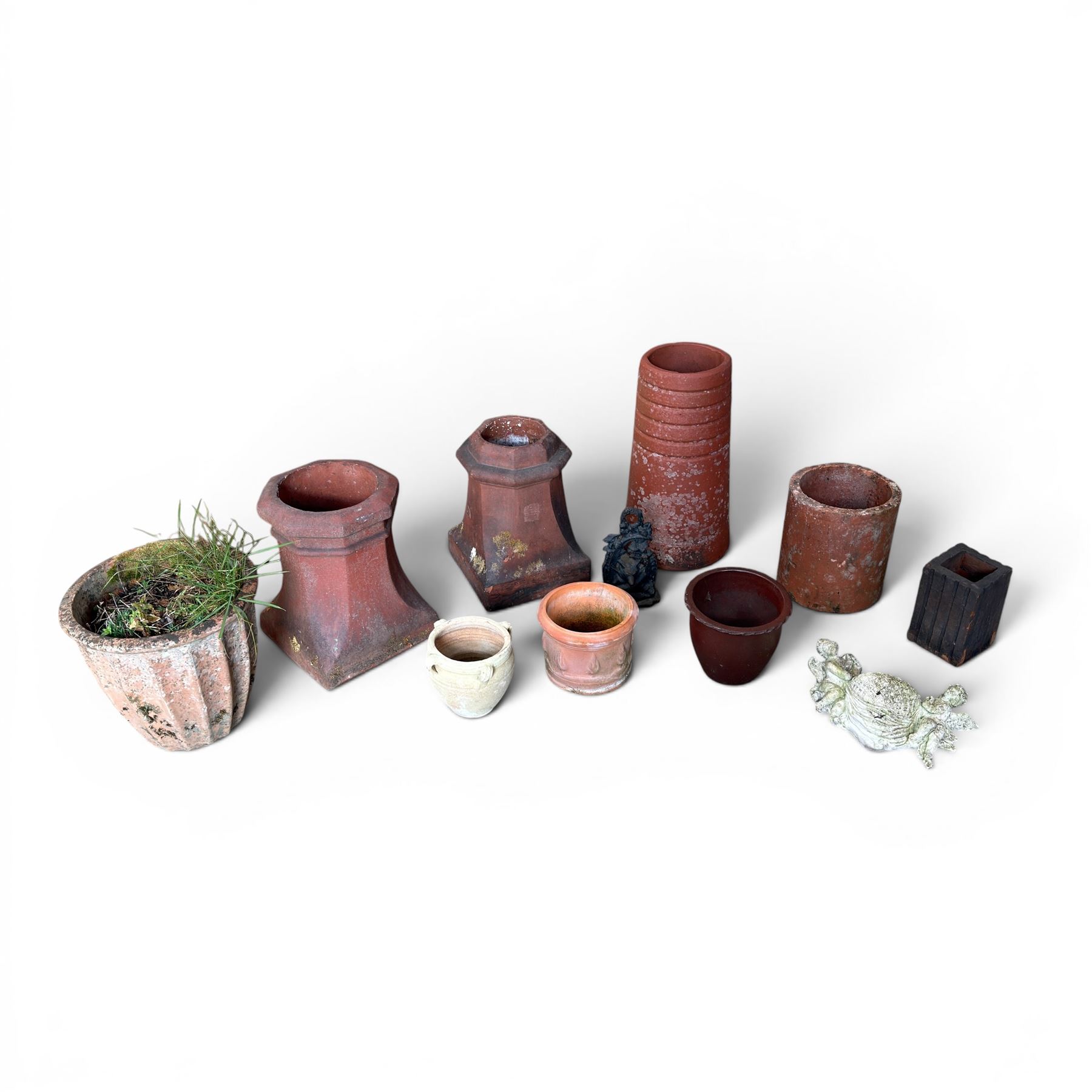 Two Victorian terracotta octagonal squat chimney pots, three other pots, terracotta planter, three small planters, cast iron fox door stop and a cherub wall pocket