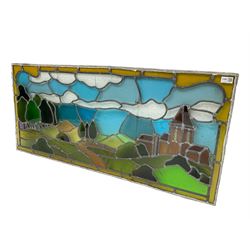 Stained and leaded glass window pane, depicting country side scene with trees and church