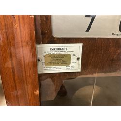 Early 20th Century Time Recorders Leeds Ltd mahogany cased clocking in machine, the square silvered dial with Arabic numerals above clocking in mechanism on plinth base, with a collection of blank clocking in cards, case H98cm