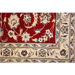  Red and ivory ground Persian rug, scrolling floral design, 199cm x 125cm  