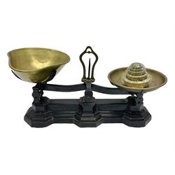 Black painted and brass kitchen balance scales with graduated set of brass weights