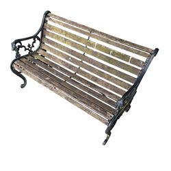 Pair of Victorian Revival Coalbrookdale design 'Dog and Serpent' pattern benches with slatted seats, the cast iron end supports of pierced and scrolling design with dog mask arm terminals
