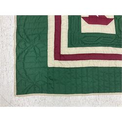 20th century quilt, with repetitive ship design to the centre within a cream red and green boarder, 227cm x 222cm