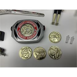 Collection of early 90s Mighty Morphin’ Power Rangers Zords, figures and accessories. Titanus the Carrier Zord, marked Bandai 1991; Green Dragonzord, incomplete; 1994 White Tigerzord with original instruction manual; 1993 Triceratops Dinozord, Mastodon Dinozord and Sabertooth Tiger Dinozord, Pterodactyl Dinozord, missing guns; with 1993 Power Morpher and original Power Coins, with further related figures, accessories and weapons