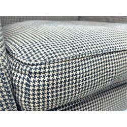 Hardwood-framed wingback armchair, upholstered in dog tooth pattern fabric, on cabriole supports 