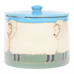 Dennis Chinaworks jar and cover, the body decorated with sheep, with a blue lid, impressed and painted marks beneath, H10cm