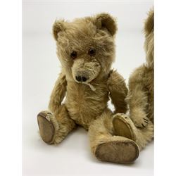 Chiltern Ting-a-Ling teddy bear c1950s with blond mohair body, swivel jointed head with glass eyes and vertically stitched nose and mouth, jointed limbs with velvet pads and card lined feet and internal chimes H14