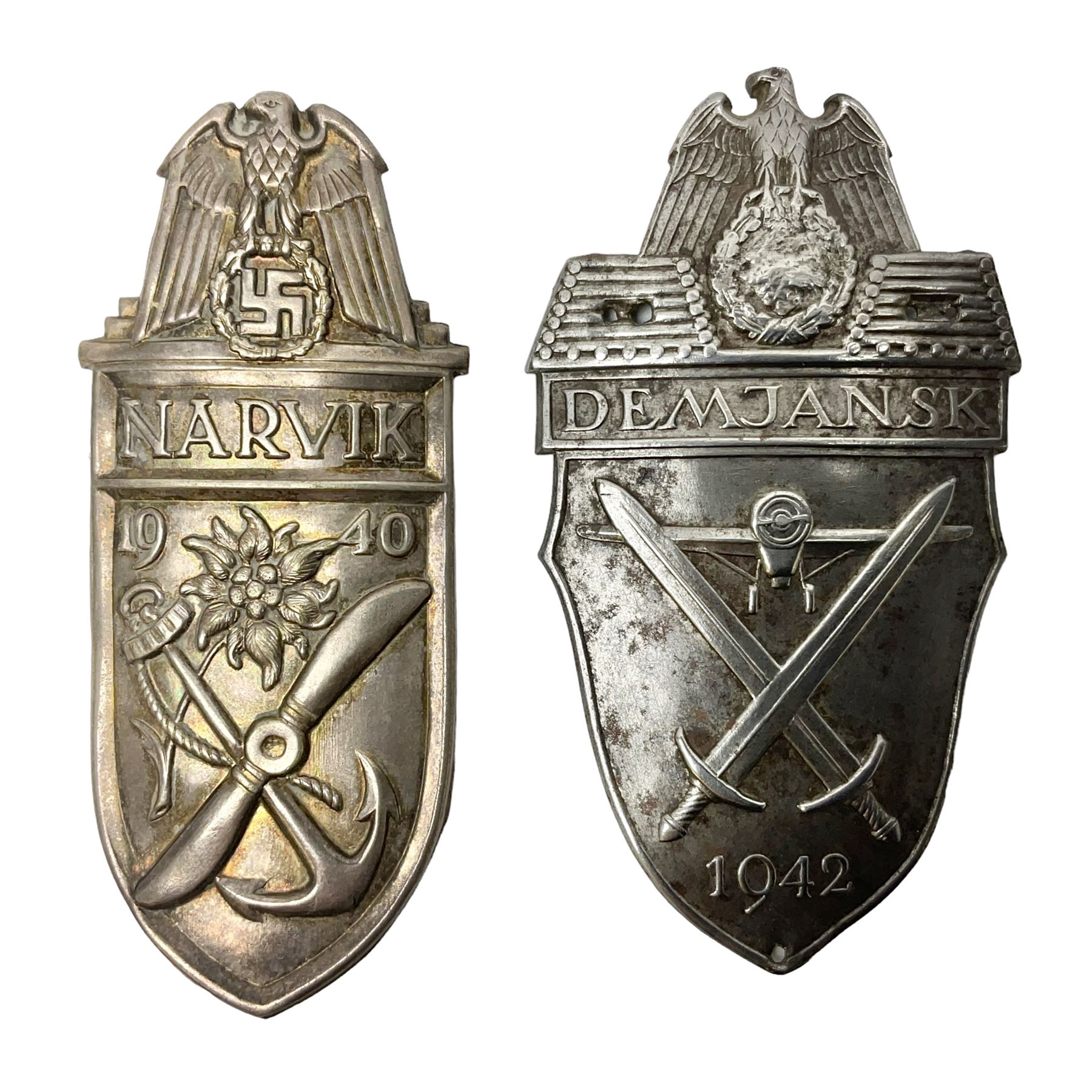 Two German Arm-Shield badges - one Russian Front marked Demjansk 1942; the other marked Narvik 1940 (2)