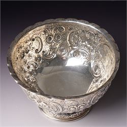 Late Victorian silver bowl embossed with flower heads and scrolls and with vacant cartouches on short pedestal foot D17cm London 1900 Maker Goldsmiths & Silversmiths Company