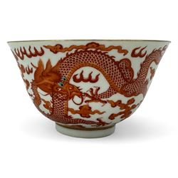 Chinese porcelain iron red tea bowl, the exterior painted with two five claw dragons chasing the flaming pearl, amidst clouds, red Quinlong seal mark beneath, D10.5cm x H6.5cm