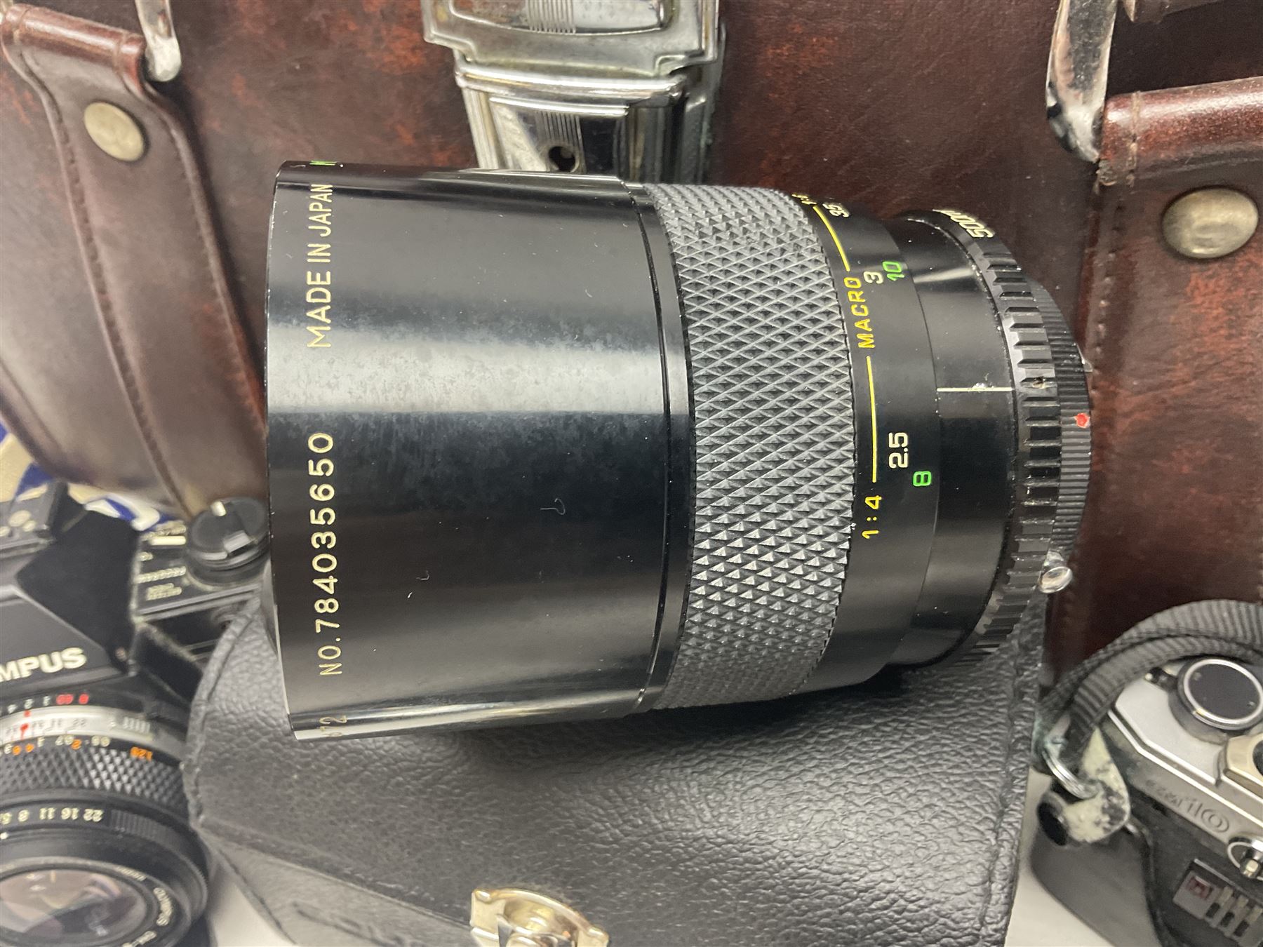 Olympus OM-2 camera body, serial no 1117526, with Olympus OM-System Zuiko Auto-W 28mm 1:2.8'  lens serial no 336591, Olympus OM10 camera body serial no 2392257, with Olympus OM-System Zuiko Auto-Macro 50mm 1:3.5' lens serial no 225784, Soligor C/D mirror lens 1:8 f=500mm' serial no 784035650 together with other camera equipment 