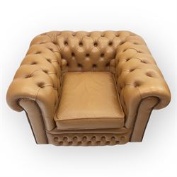 Contemporary set of two tan leather armchairs, comprising a deep-buttoned chesterfield and a matching wingback chair, both with rolled arms, studded borders