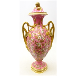  Large Royal Crown Derby two handled vase and cover, the lobed ovoid shaped body profusely decorated with Jasmine flowers and gilded foliage on pink ground with two naturalistic gilded handles and leaf terminals on a quatrefoil base, shape no. 207 and printed marks, H54cm x W25cm   