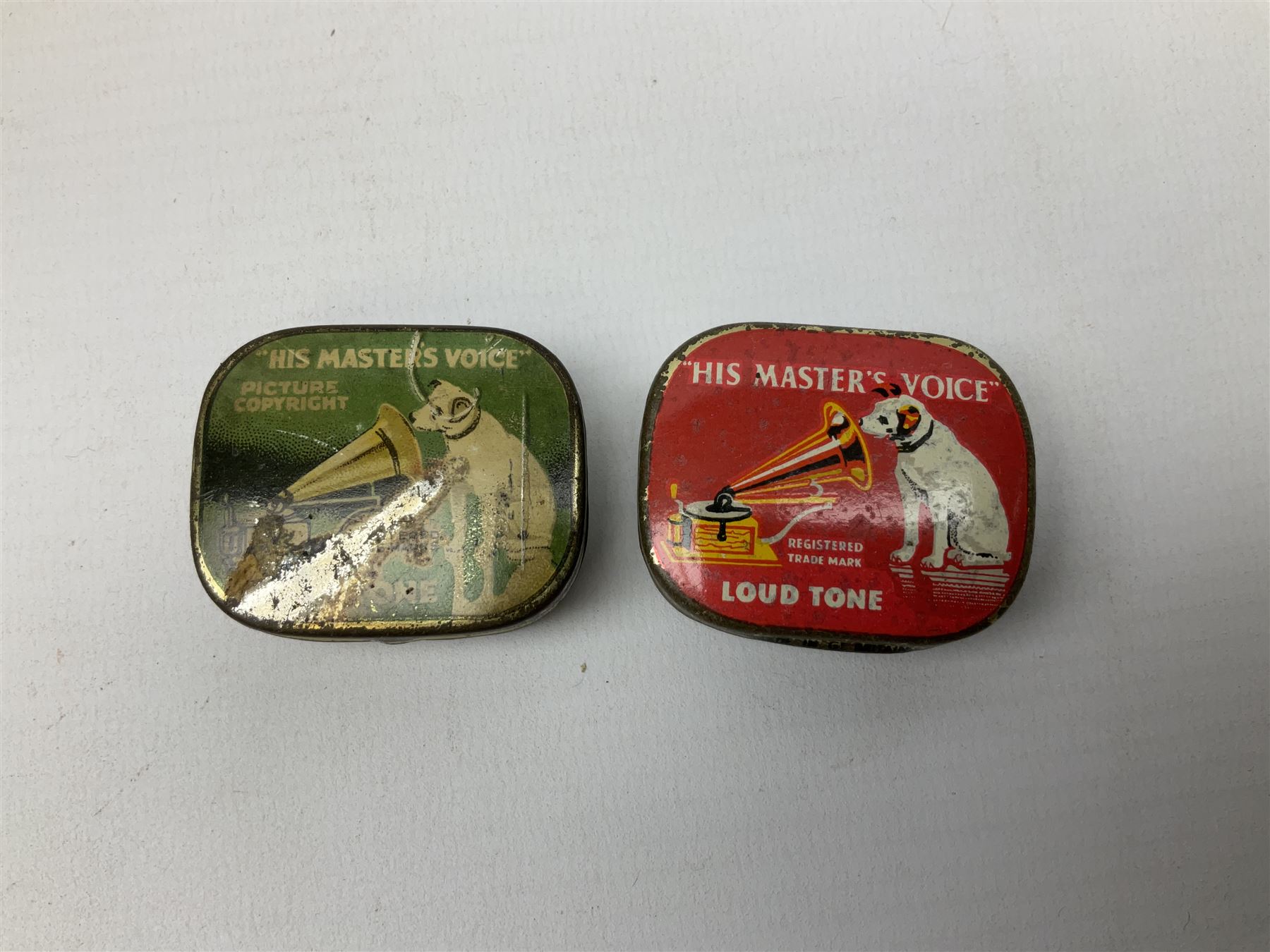 Early 20th century wind up gramophone set in a wooden case with twin door sound hole to the front and tins of 'His Masters Voice' needles