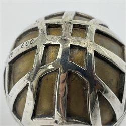 Modern silver limited edition Easter egg, no. 70/500, the gilded body decorated in relief with silver latticework and a band of flower heads, the detachable cover opening to reveal a gilt interior, each hallmarked St James House Company, London 1978, H5.5cm