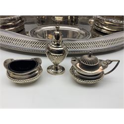 Pair of Mappin and Webb silver plate pierced pedestal bon bon dishes, together with other silver plate comprising teapot stand engraved with lion's head to centre, two cut glass claret jugs, two bottle coasters with acorn decoration, two open salts upon dolphin mounts, tea caddy, three piece cruet set and a large oval tray with pierced sides and upon four ball feet