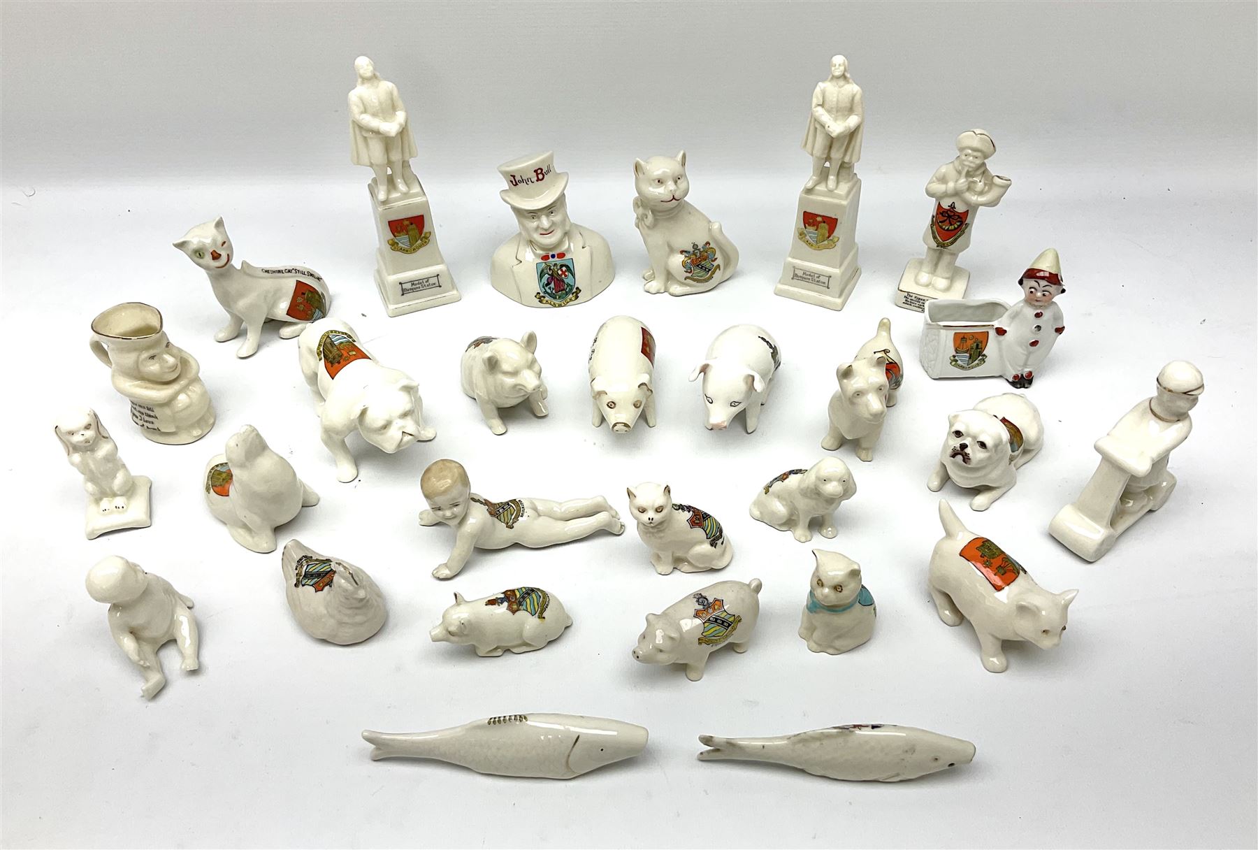 Collection of figural crested ware, to include Carlton Chins John Bull Alnwick, Clifton China Cheshire Cat,  Arcadia pig, Crafton crawling baby and another seated baby, quantity of cat, dog and pig figures, two Willow Art Model of Bunyans Statue, Toby jug, Victoria China, Arcadan bulldog, fish etc