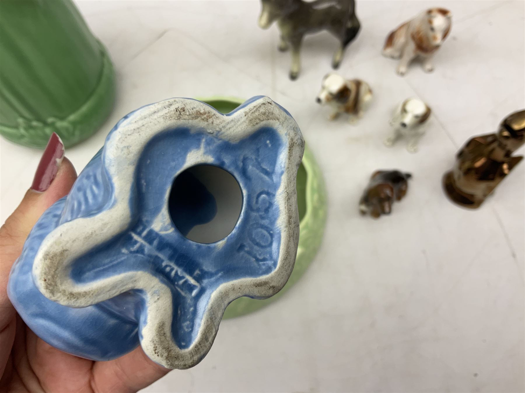 Sylvac blue rabbit no. 1067, green horse no. 1334, jug with squirrel handle no. 1958 (a/f), Royal Doulton dog figure, and other ceramics in one box