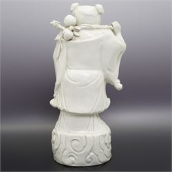 Chinese blanc de chine figure of Shou Lao, standing upon a cloud, H36cm 