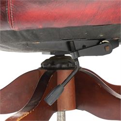 Georgian design captains swivel desk chair, rolled cresting rail over open spindle back on swivel action, upholstered in buttoned oxblood leather