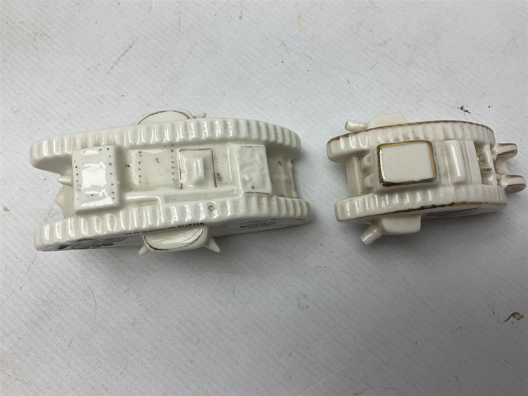 Twelve crested china models of WW1 tanks by Grafton, Arcadian and Carlton china etc with crests from Caistor Lincs, Saffron Walden, Paignton, Evesham etc  , together with a crested china model of the R.M.S Lusitania with New Brighton crest and a two-handled vase for 'The Forts Boxhill' (14)