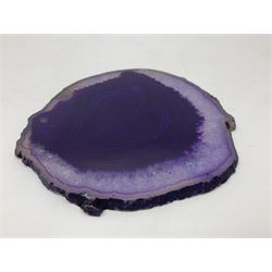 Pair of purple agate slices, polished with rough edges, raised upon gilt metal stands
