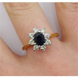 Gold oval sapphire and diamond cluster ring, stamped 18ct, sapphire approx 0.60 carat
