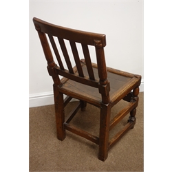 Pair of country made late 17th/18th century oak chairs, moulded slat backs and solid seats on turned supports with carved front and plain side stretchers, H87cm