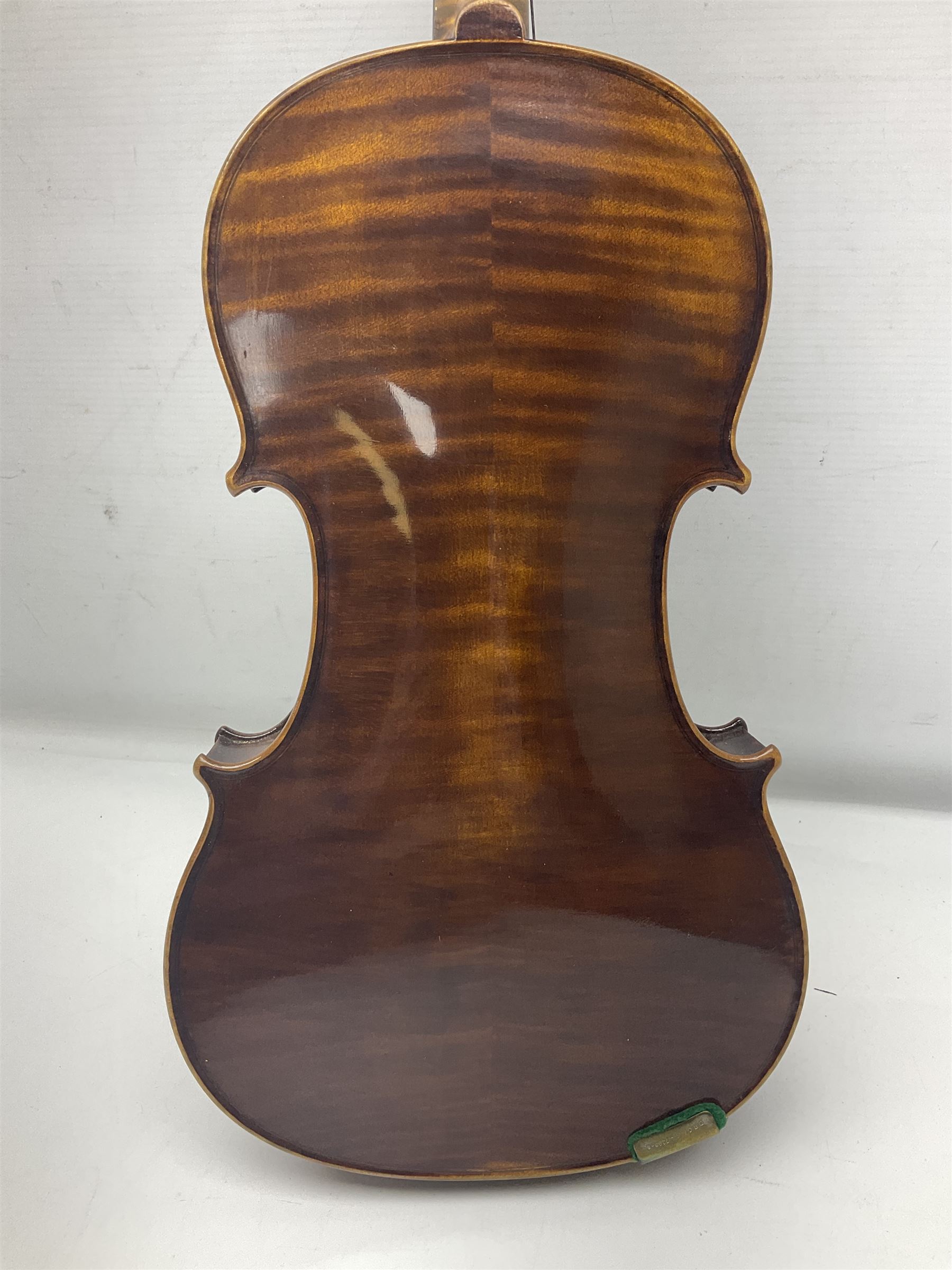 German trade violin c1900 with 35.5cm two-piece maple back and spruce top; bears label 'Made in Germany Apollo Class 6 No.2132' L59cm; in carrying case with two bows