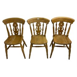 Set of six solid beech farmhouse kitchen or dining chairs, shaped and pierced splat back over shaped seat, raised on ring turned supports united by H-stretcher