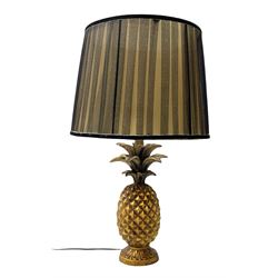 Composite table lamp, modelled as a gilt pineapple, with a pleated fabric lampshade, H58.5cm
