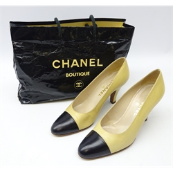  Pair of Chanel cream and black leather heeled court shoes size 39 1/2 with carrier bag   