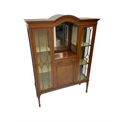 Edwardian inlaid mahogany display cabinet with ‘Shepard, Bennington & Co. Doncaster’ makers plaque, central bevel edge mirror flanked by two glazed doors enclosing two lined shelves, single drawer above cupboard on square tapering supports with spade feet