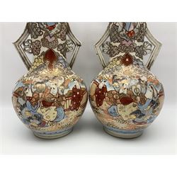 Pair of Japanese Satsuma vases decorated with four panels of figures in a landscape setting between patterned borders, character marks to the base, together with another pair of Satsuma vases and well bucket, largest vase H47cm