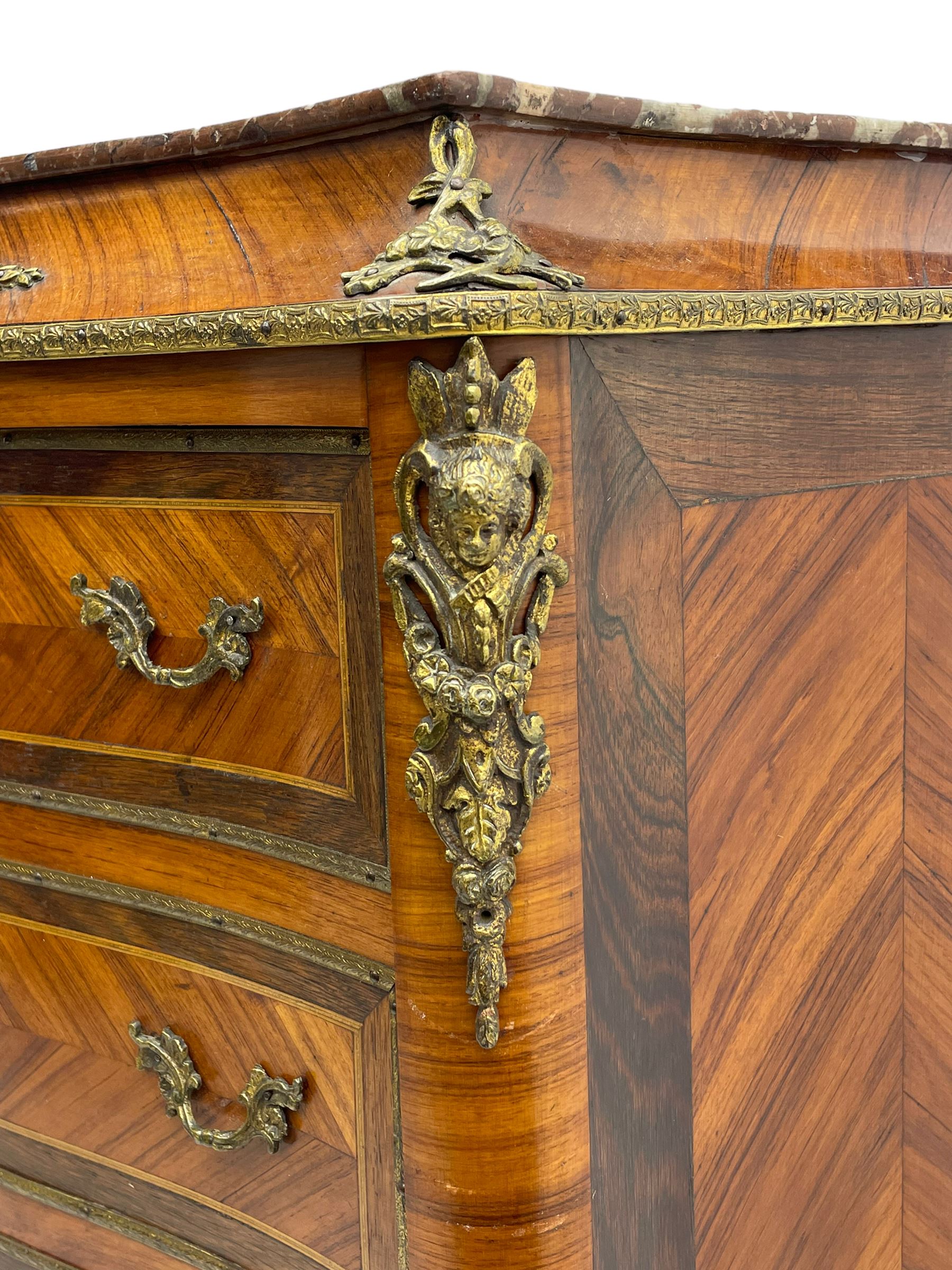 Mid-20th century Louis XVI design Kingwood and walnut secretaire à Abattant, shaped serpentine form with dark rouge variegated marble top, the fall front disguised as three drawers enclosing birdseye maple interior with shelf, drawers and writing surface, four functioning drawers below, decorated with cast gilt metal mouldings and mask cartouches, on skirted base with egg and dart moulded gilt metal edge