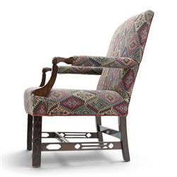 Chippendale design Gainsborough elbow chair, upholstered in kilim fabric, blind fretwork and acanthus carving