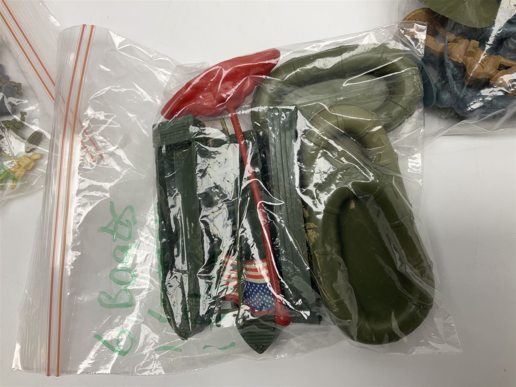 Ten 1980s Action Man Action Force figures with six original card backs; over three-hundred and forty Airfix large scale plastic soldiers; over two-hundred and thirty small scale plastic soldiers; together with accessories including boats, ladder etc