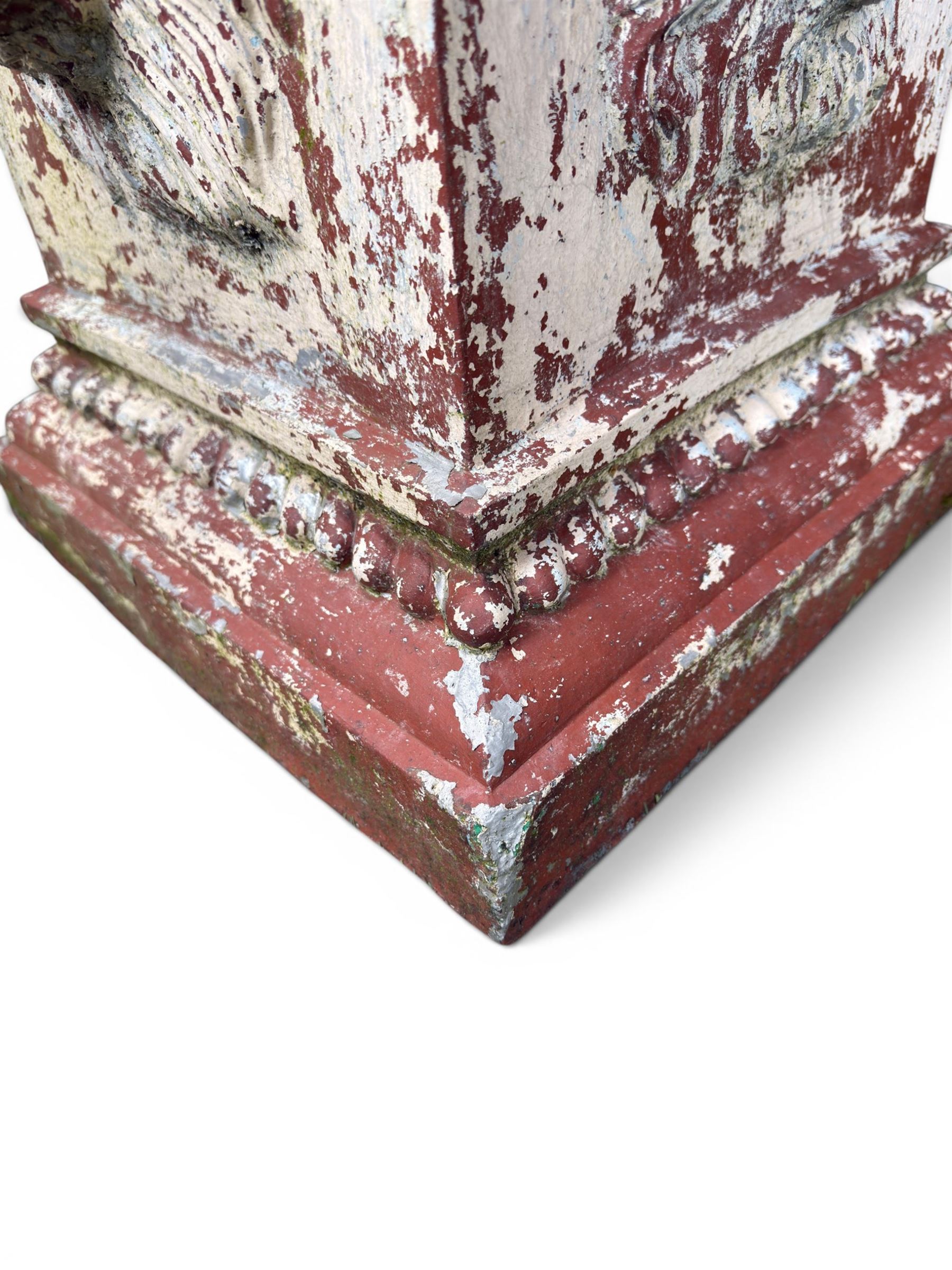 Early 20th century terracotta pedestal, square form with egg and dart detail, four lions masks to either side, finished in distressed cream paint