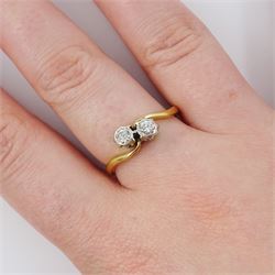 18ct gold diamond crossover ring, set with two round brilliant cut diamonds, Birmingham 1962, total diamond weight approx 0.25 carat