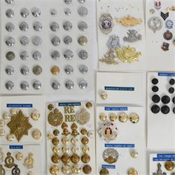 Collection of military cap badges, buttons and similar, including examples for Royal Army Medical Corps, Royal Army Pay Corps, Royal Engineers etc 