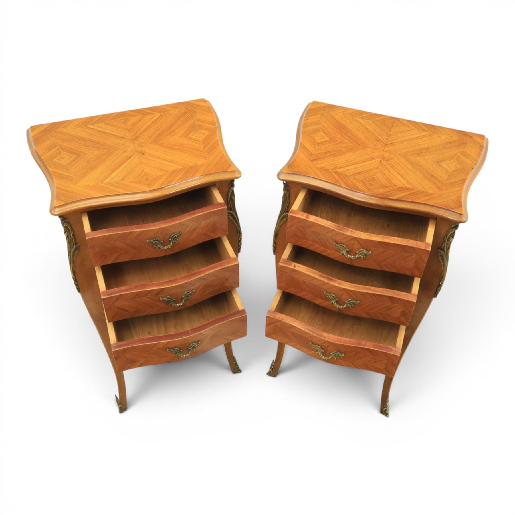 Louis XV style pair of kingwood bedside chests, each of serpentine outline with three parquetry drawers, gilt metal mounts and handles, raised on slender cabriole legs