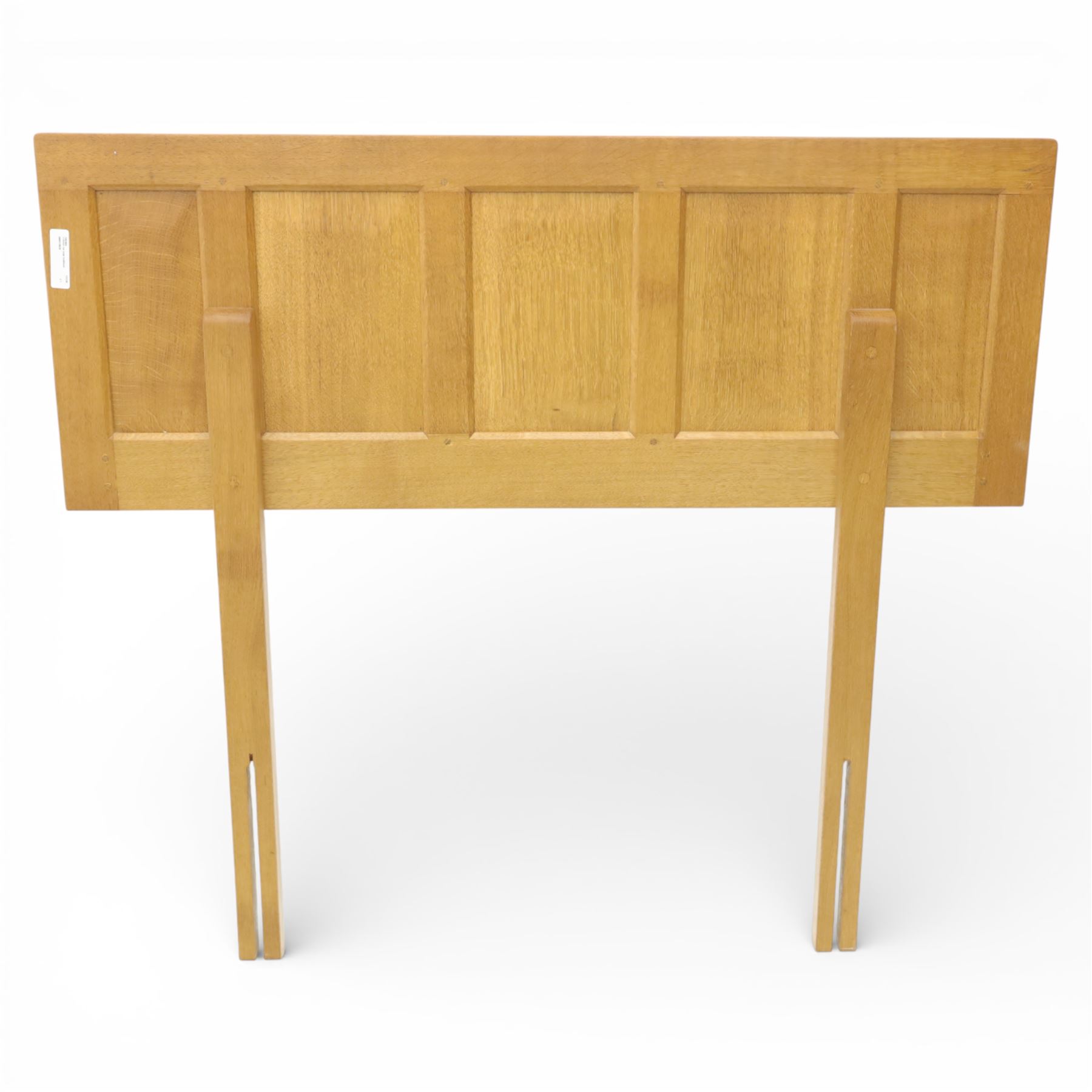 Yorkshire oak single headboard, the panelled back with visible dowls, raised upon plain supports 