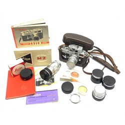 Leica M2-1013180 camera fitted with Leica Summicron 1:2/50 Leitz Wetzlar lens (1764800) and UVa filter, and Leica-Meter MR in leather case together with; Leica Elmarit 1:2.8/90 LW lens (1805634), Leica Summaron 1:28/35 LW lens (1782507), Leica M3 M2 adapter ring, Leica filters yellow and orange cased, three Leica lens hoods IUFOO, IROOA and 12585H (boxed), Leica pocket book, guide and 1960s survey catalogue & price guide leaflet, with original M2 camera box