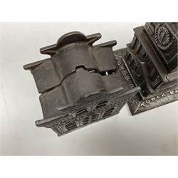 Five early 20th century cast-iron money banks as buildings - 'City Bank' c1904 H10cm; 'County Bank' c1905 H11cm; 'Town Hall Bank' c1900 H8.5cm; 'Tower Bank' c1902 H23.5cm; all made by John Harper; and 'Blackpool Tower Bank' c1907 by Chamberlain & Hill H18.5cm (5)