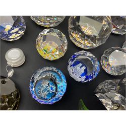 Swarovski Crystal paperweights, to include a globe with dove to the top, pyramid shapes etc, together with a large collection of boxes and stands  