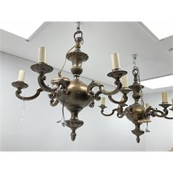 A pair of bronzed six branch chandeliers of Dutch 17th century style, each with bulbous knopped column, hung with scrolling branches and dish pans, H66cm.