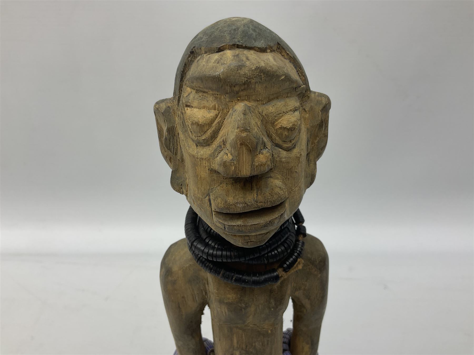 Early 20th century West African Yoruba family wooden figure of Orisha Oko, the god of farming/agriculture, carved from the solid, bears manuscript label of provenance verso H26.5cm