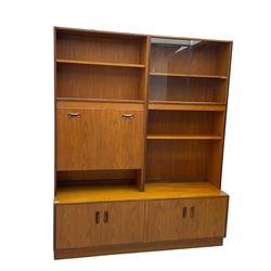 G-Plan - mid-20th century teak modular wall cabinet, fitted with shelves, display cabinet, fall front compartment and two double cupboards