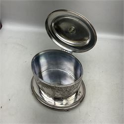 Late Victorian silver-plated biscuit barrel by William Hutton & Sons, on integral stand with four bun feet and ornate foliate engraved decoration, H20cm