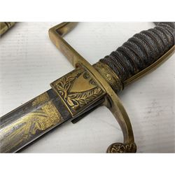 German Saxon 1st Empire Light Cavalry officer's sword c1820s, the 79cm clipped curving blade engraved with the crest of Hanover and various battle trophies with traces of blueing and gilding, brass hilt with knucklebow, foliate square langets, ornate downswept quillon, wire-bound fish skin grip with lion's head pommel; in brass scabbard with two suspension rings L95cm overall